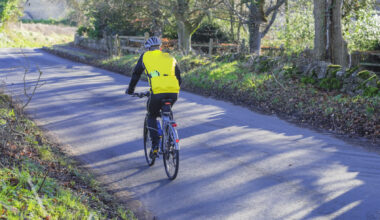 Man on bike on country road