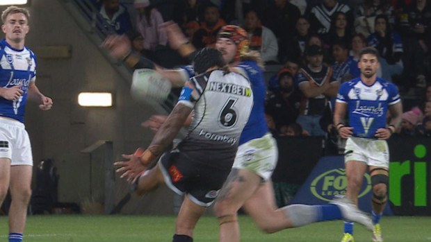 Josh Curran charges down a Jarome Luai kick.