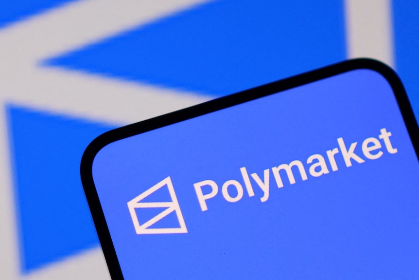 The word "Polymarket" appears on a phone screen.