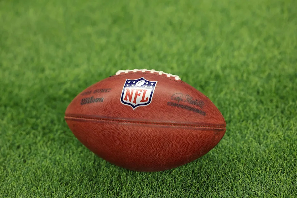 INDIANAPOLIS, INDIANA - DECEMBER 22: A detailed view of an NFL logo is seen on a football as the Tennessee Titans take on the Indianapolis Colts at Lucas Oil Stadium on December 22, 2024 in Indianapolis, Indiana. (Photo by Andy Lyons/Getty Images)
