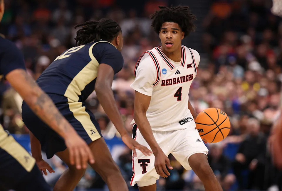 Texas Tech guard Christian Anderson dribbles against Akron guard Evan Mahaffey in the first half during a first-round game of the NCAA Tournament at Benchmark International Arena, March 20, 2026, in Tampa, Florida.