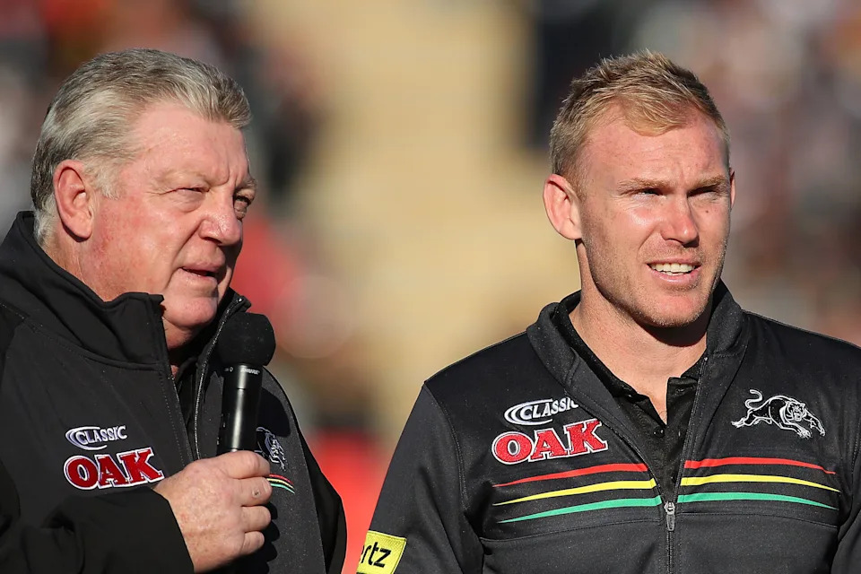 Pictured right is Panthers assistant coach Peter Wallace.