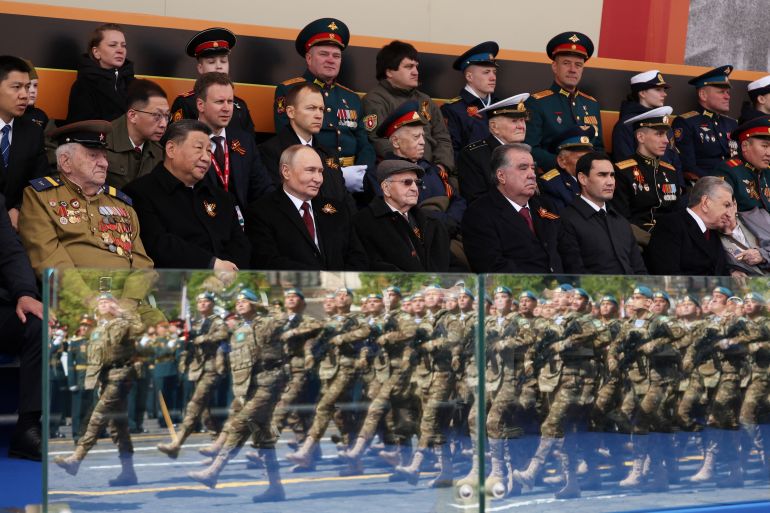 Spectators, including Russian President Vladimir Putin, Chinese President Xi Jinping, Tajik President Emomali Rahmon, Turkmen President Serdar Berdimuhamedov and Uzbek President Shavkat Mirziyoyev, attend a military parade on Victory Day, marking the 80th anniversary of the victory over Nazi Germany in World War Two, in Red Square in central Moscow, Russia, May 9, 2025. Sputnik/Vyacheslav Prokofyev/Pool via REUTERS ATTENTION EDITORS - THIS IMAGE WAS PROVIDED BY A THIRD PARTY.