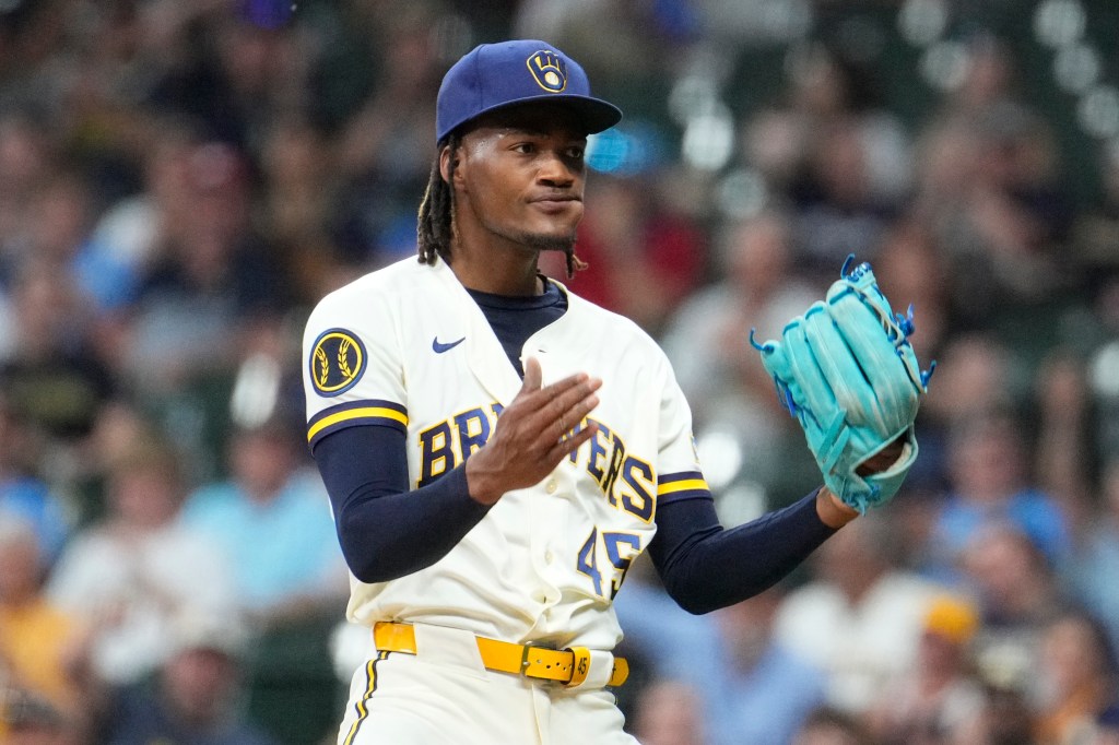 Milwaukee Brewers pitcher Abner Uribe (45) celebrates the final out of in the eighth inning against the St. Louis Cardinals at American Family Field. 