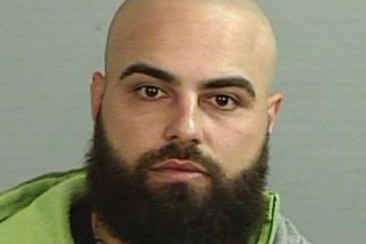 Bald man with a beard in profile shot