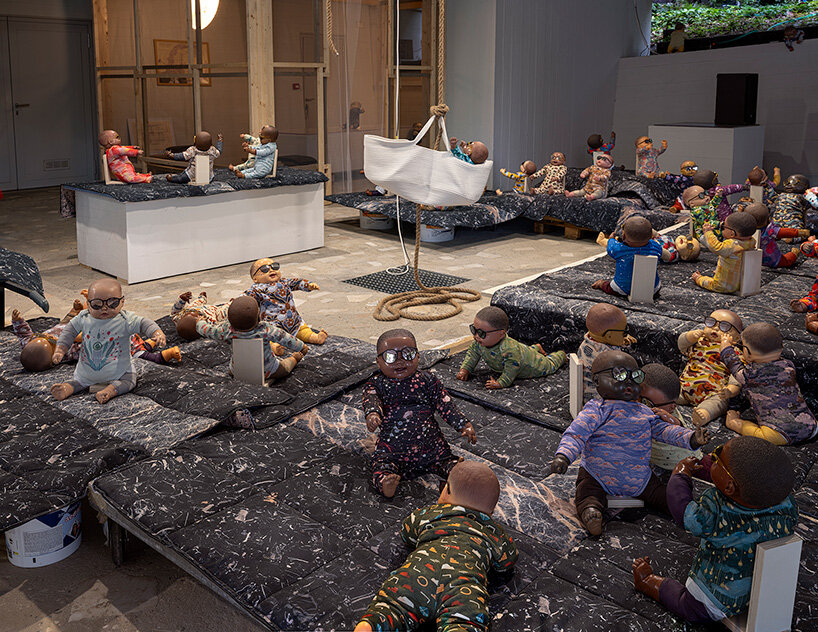 208 baby dolls animate japan pavilion in ei arakawa-nash's playful ode to care - 1