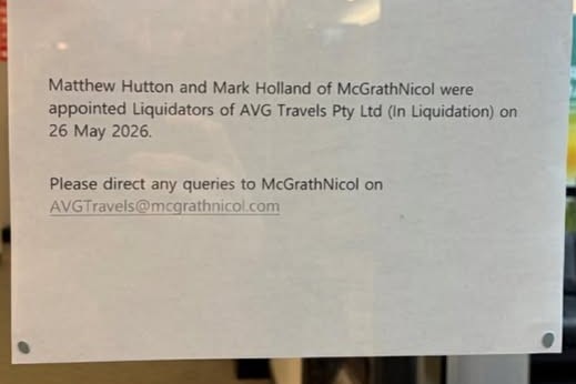A piece of paper stuck on a glass door saying McGrathNicol were appointed liquidators of AVG Travels on May 26.