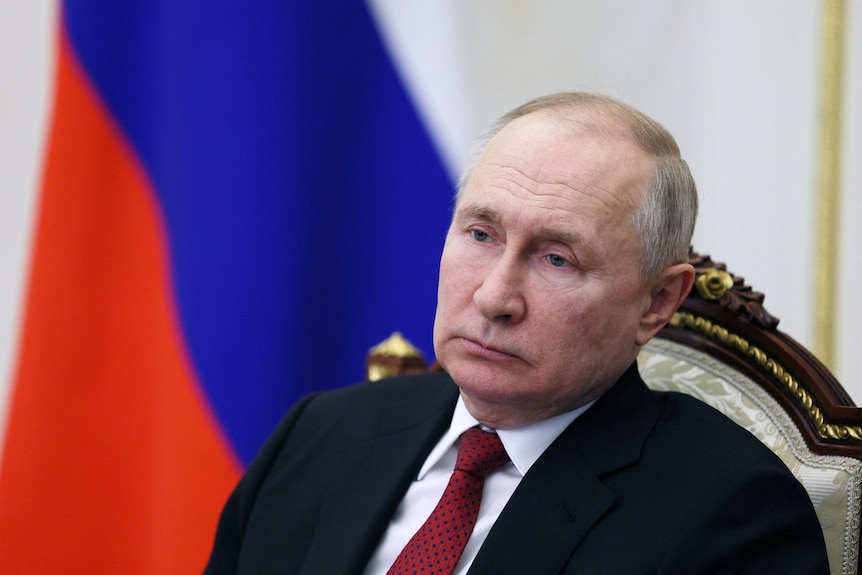 Russian President Vladimir Putin chairs a meeting with members of the government