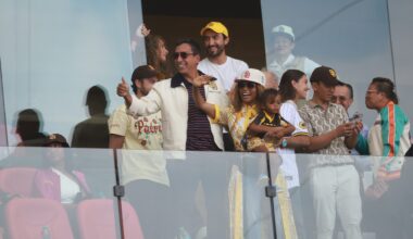 New owners of San Diego Padres José E. Feliciano and his wife Kwanza Jones wave in the stands during a game in Mexico City.