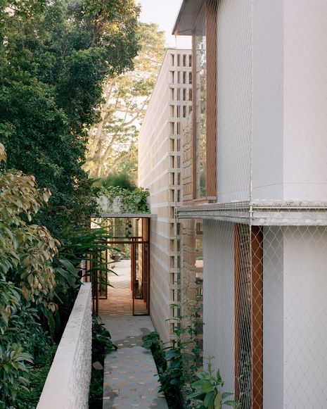 Living walls go beyond decorative application to become performative envelopes and climatic buffers for the home.