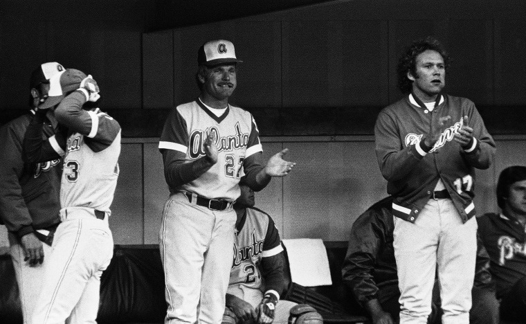 Atlanta Braves owner and manager Ted Turner cheers for his team as they play the Pirates at Three Rivers Stadium on May 11, 1977, in Pittsburgh.