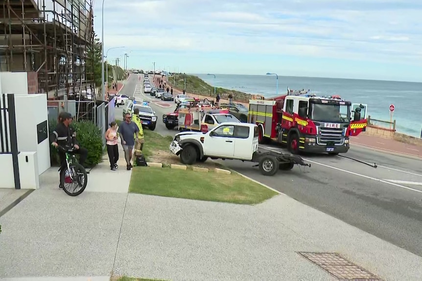 A fire truck at the scene of an incident on a coastal road