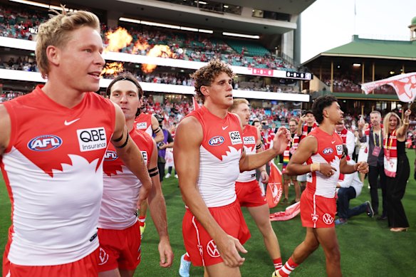 Swans academy product Isaac Heeney (left) runs onto the SCG.