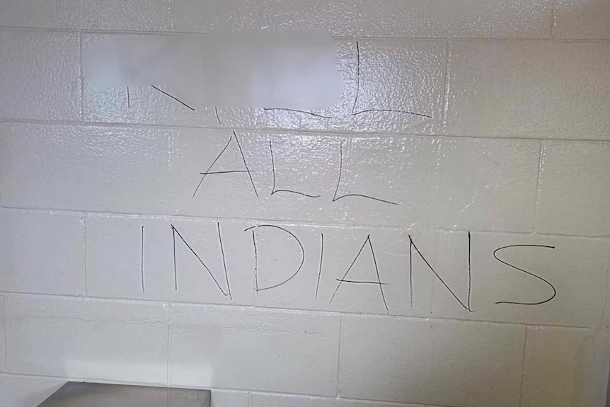 Graffiti on a public bathroom wall