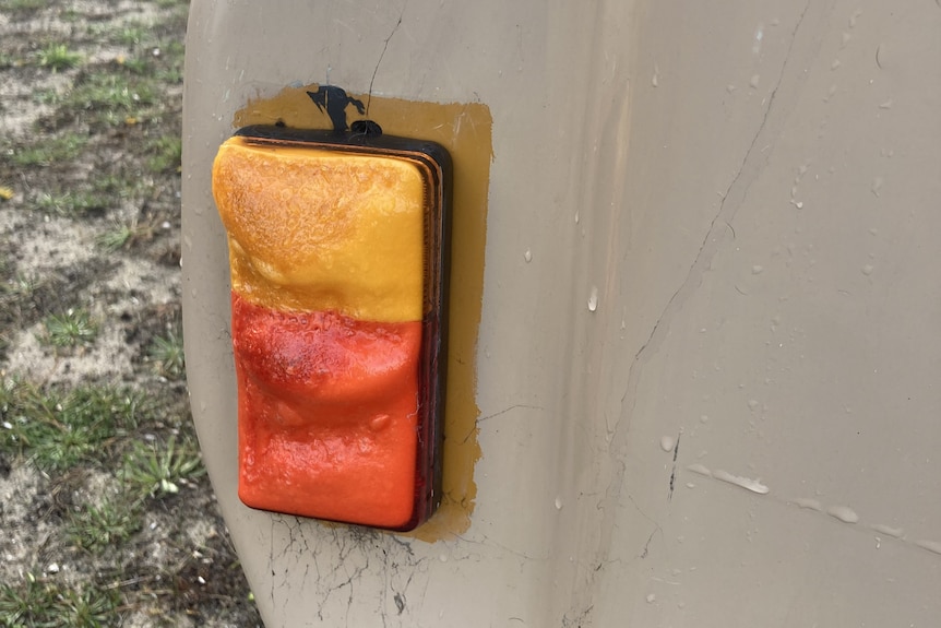 A tail light that has melted due to fire