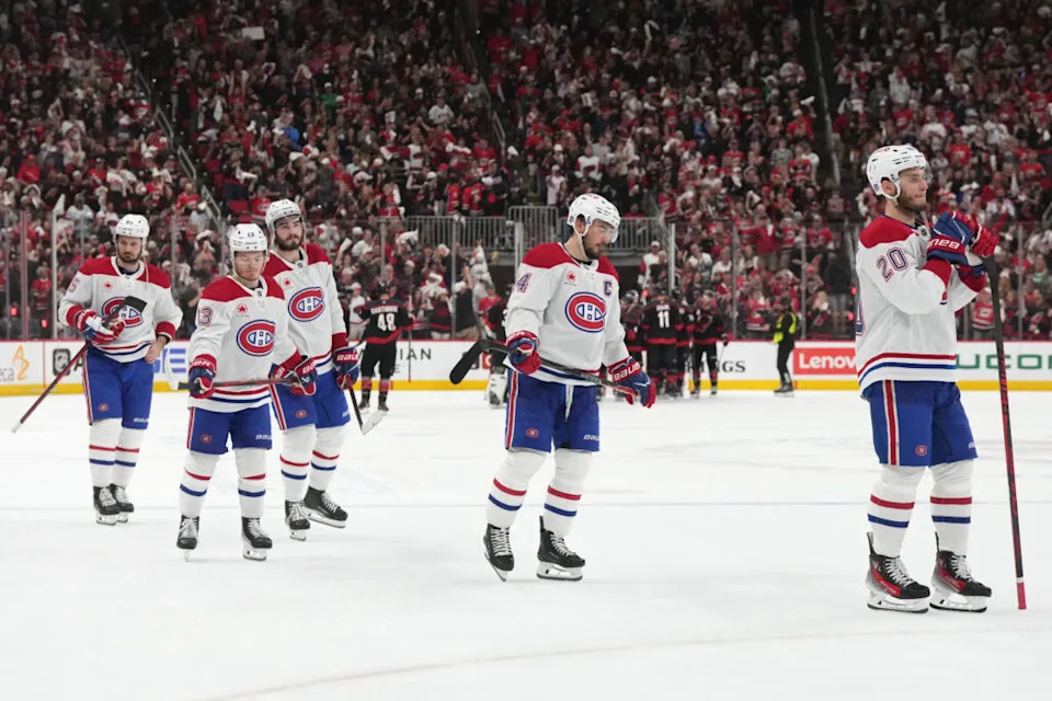 Montreal Canadiens left wing Juraj Slafkovsky (20) skates toward goaltender Jakub Dobes (not pictured) with center Nick Suzuki (14), right wing Cole Caufield (13) at Lenovo Center