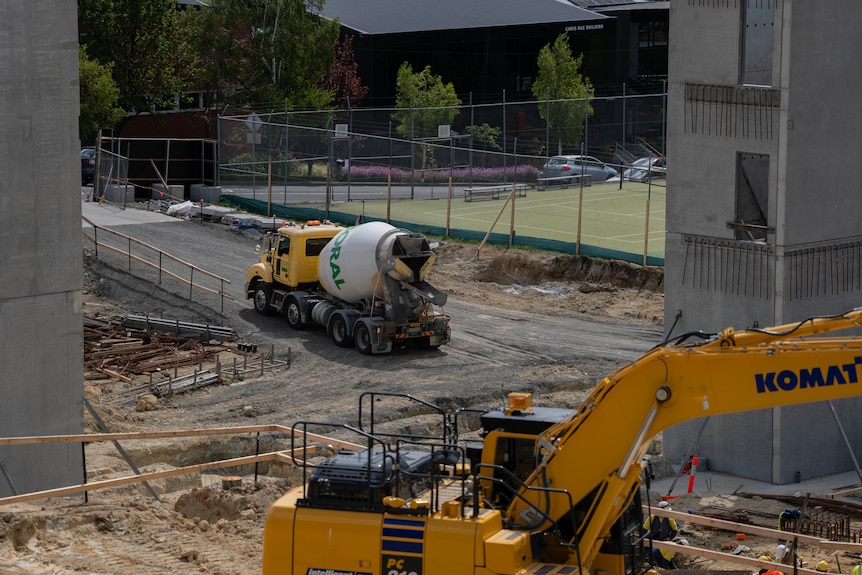 Concrete mixer truck at construction site.
