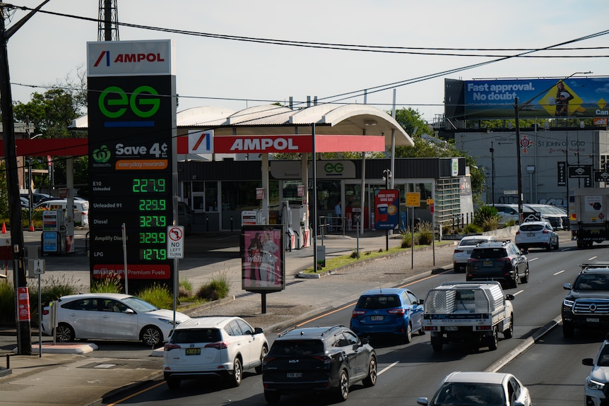 A petrol station on a busy road advertises fuel prices of more than 227.9 cents a litre.