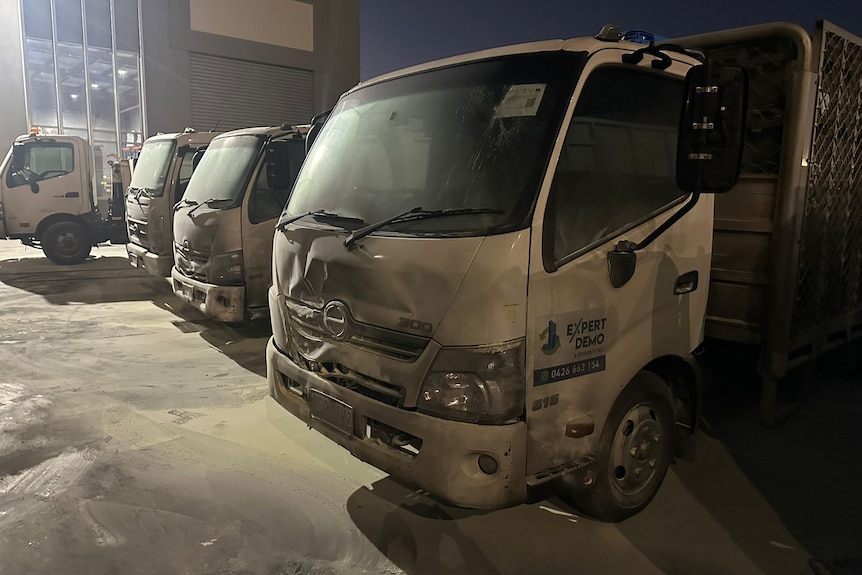 Several trucks with fire damage.