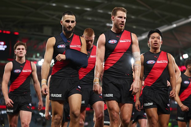Saad El-Hawli and Ben McKay of the Bombers leave the field.