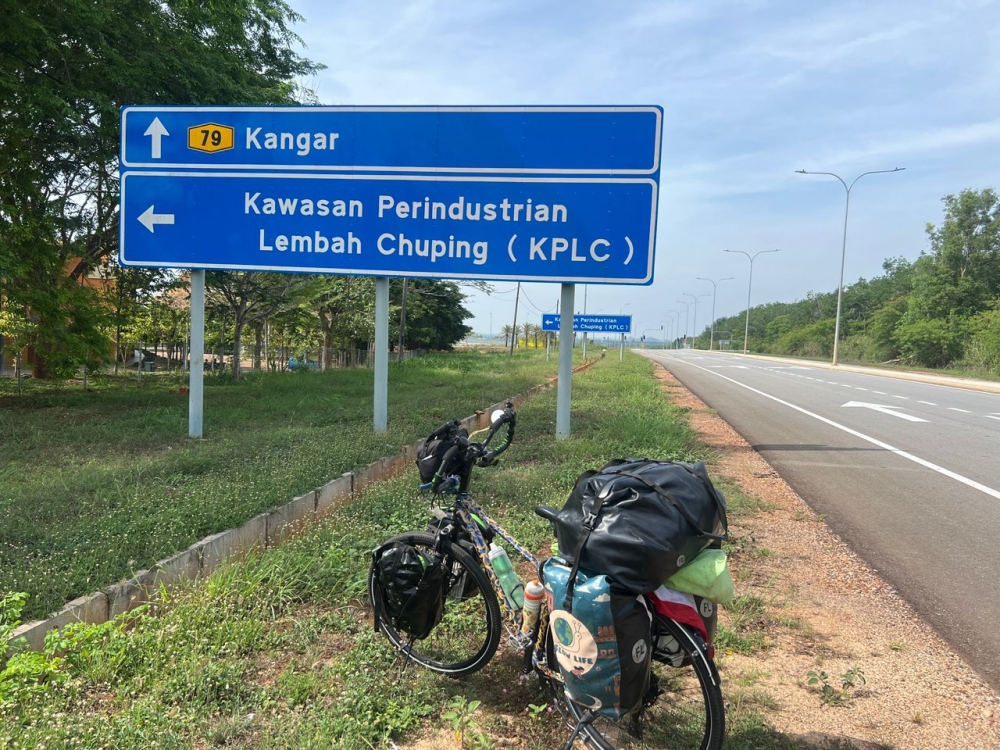 Arezoo Eskandari carries 60kg of essentials, including clothes, cooking utensils, first aid supplies, and a toolbox for her bike. — Picture courtesy of Arezoo Eskandari