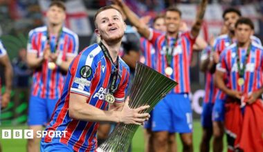Adam Wharton celebrates with Conference League trophy