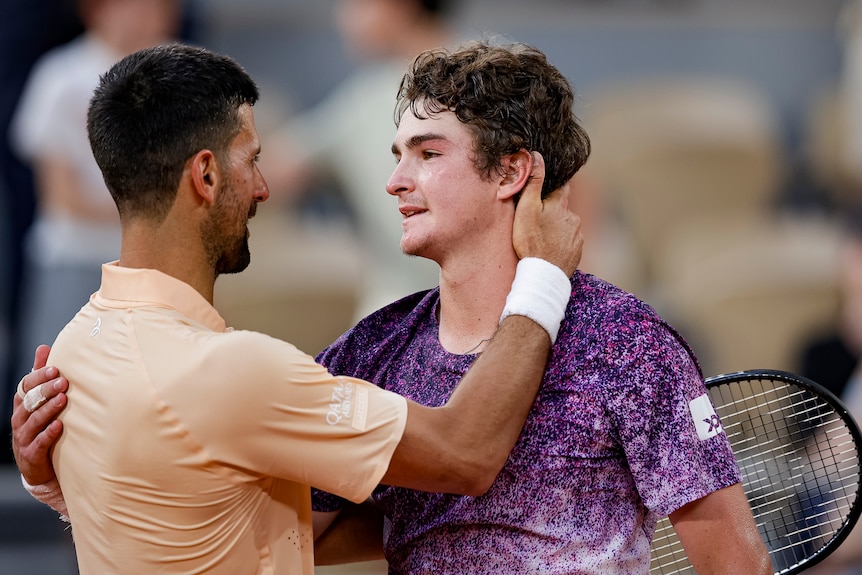 Novak Djokovic and Joao Fonseca share a heartfelt embrace