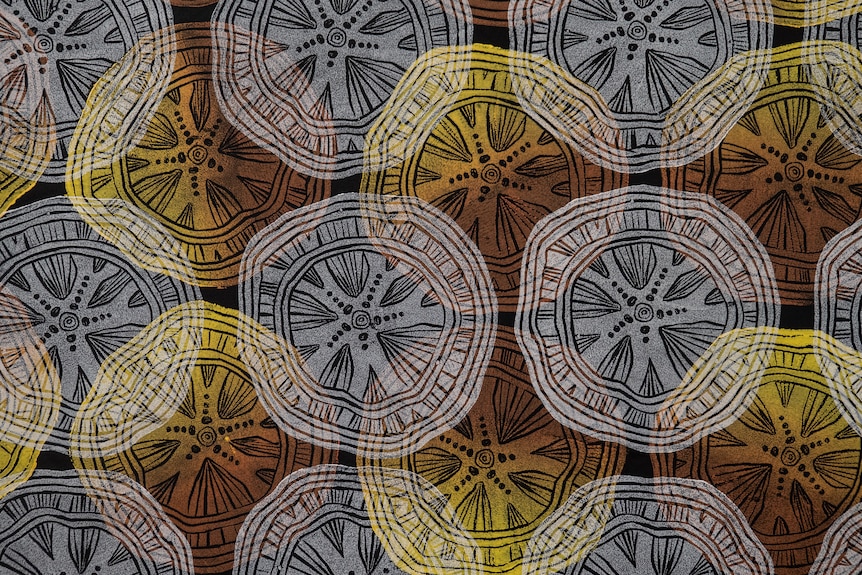 Brown white and yellow circular design block printed on fabric