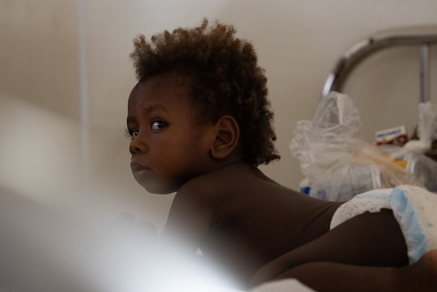 A child waits patiently at Bougainville's main hospital in Buka.