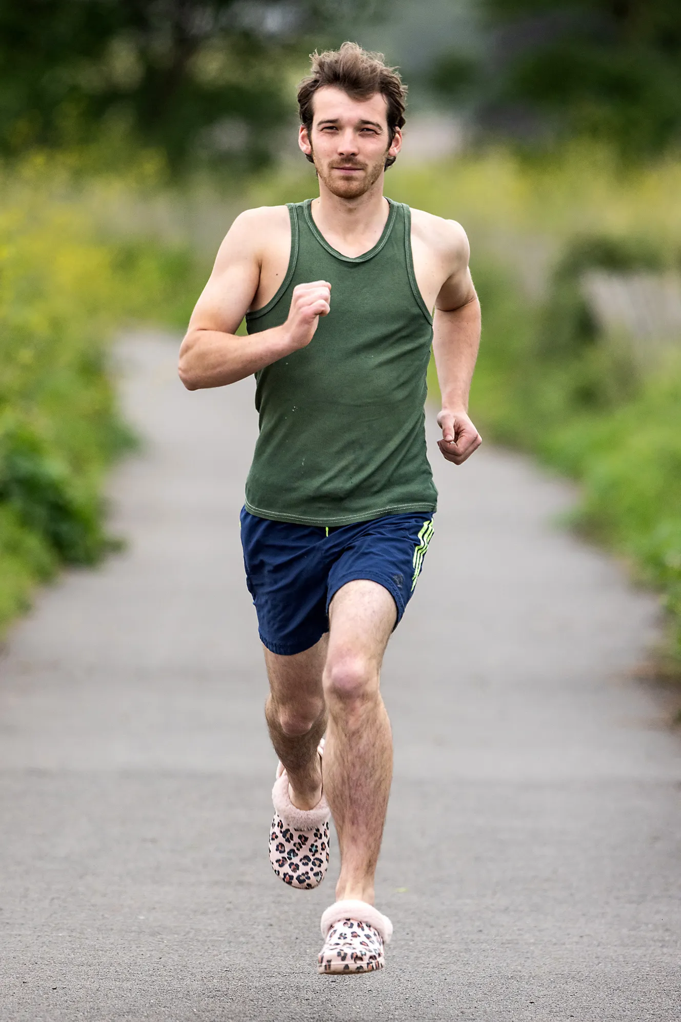 Sam Tull running a "Crocs for Crocs" challenge in leopard print Crocs to raise funds for a new crocodile house.