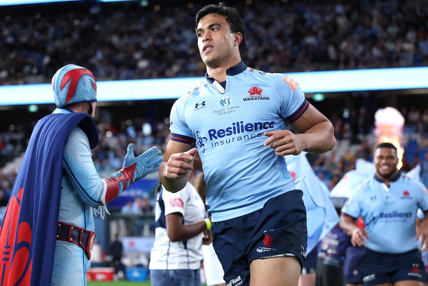Joseph Aukuso-Suaalii  runs onto the field for the Waratahs against the Force in 2026.