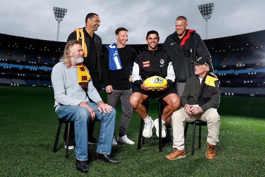 Michael Tuck, Shaun Burgoyne, Brent Harvey, Scott Pendlebury, Dustin Fletcher and Kevin Bartlett pose