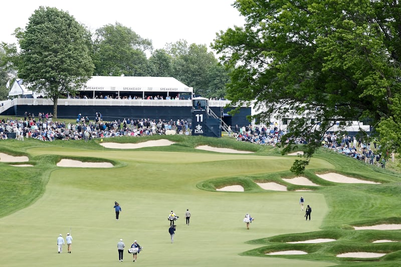 Viktor Hovland of Norway, Collin Morikawa of the United States and Shane Lowry of Ireland walk the 11th fairway at Aronimink. Photograph: Jamie Squire/Getty