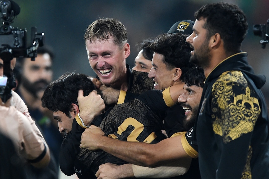 Marnus Labuschagne celebrates and hugs teammates.