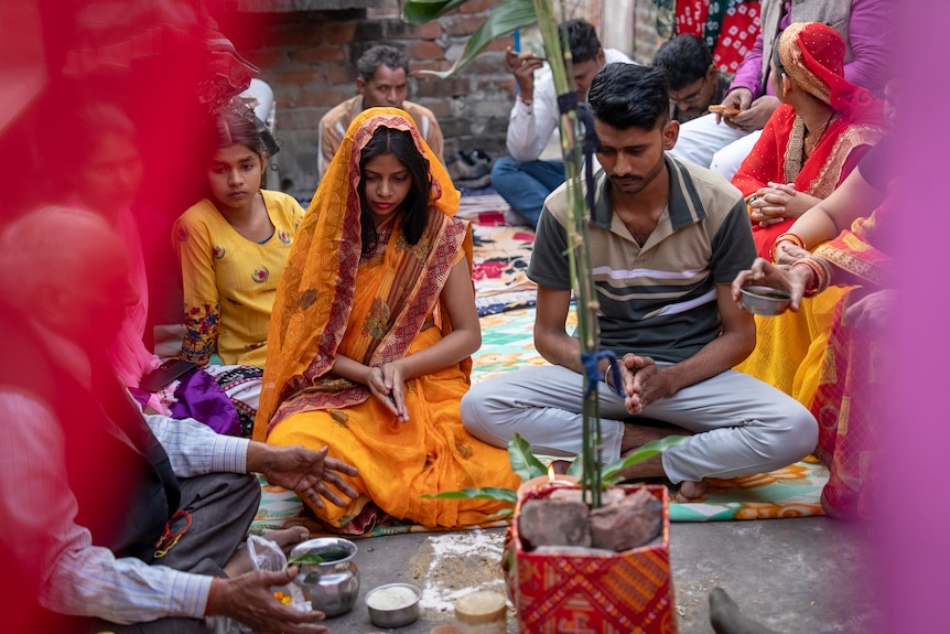 Two people praying.