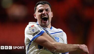 Regan Poole celebrates after Portsmouth win a game