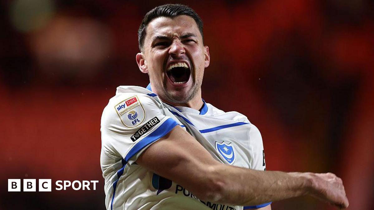 Regan Poole celebrates after Portsmouth win a game
