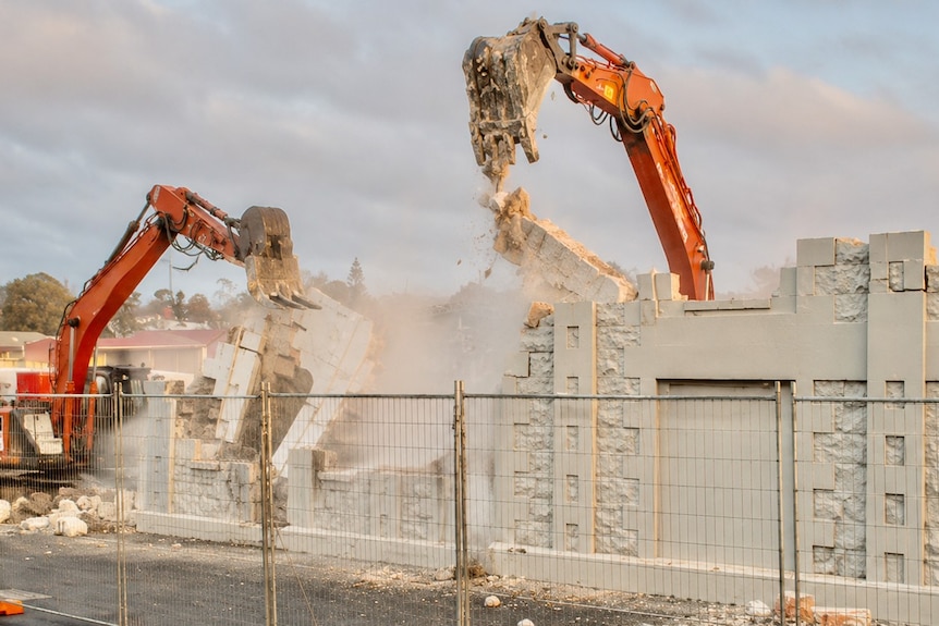 demolition cranes at the site of the former flour mill