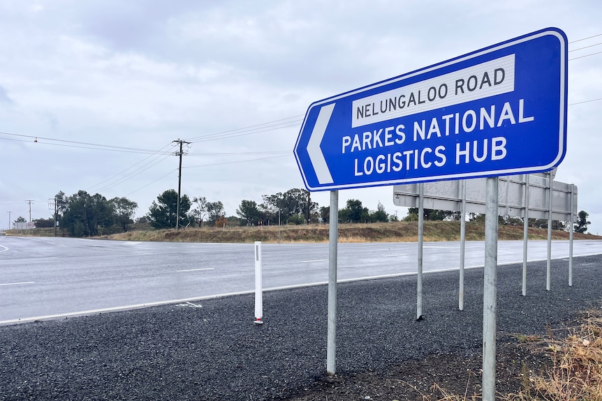 A sign for Parkes National Logistics Hub on the side of a road.