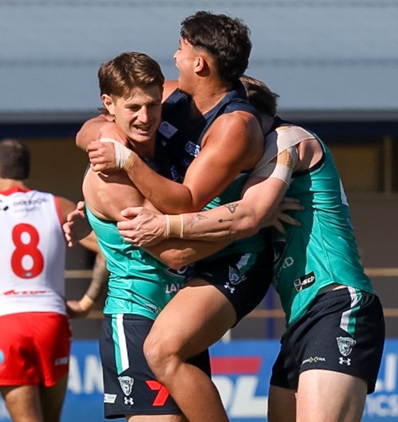 Jack Sears celebrates a goal in his 100th match with Adam Sweid and Corey Tregenza.