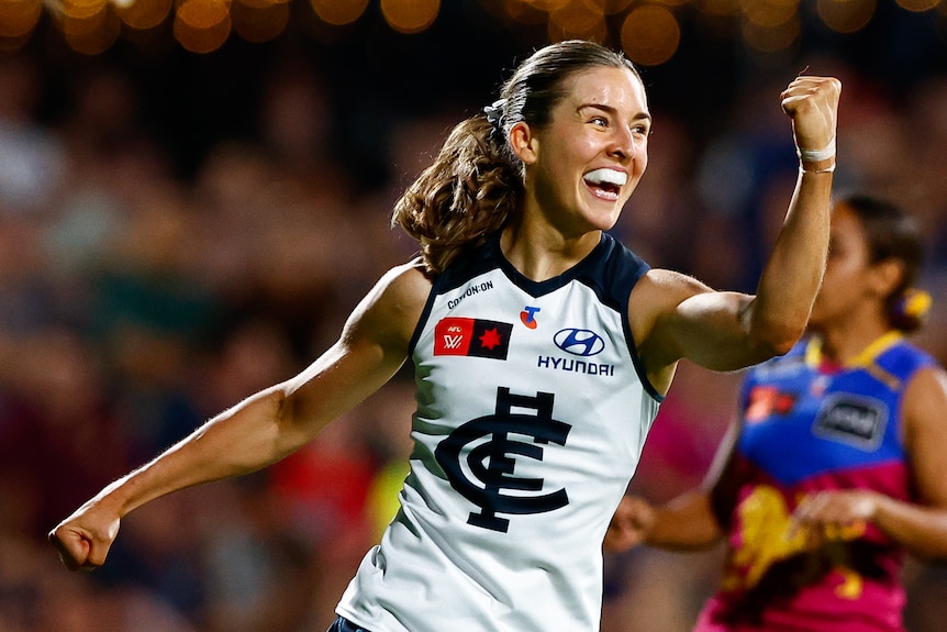 Dayna Finn celebrates a goal