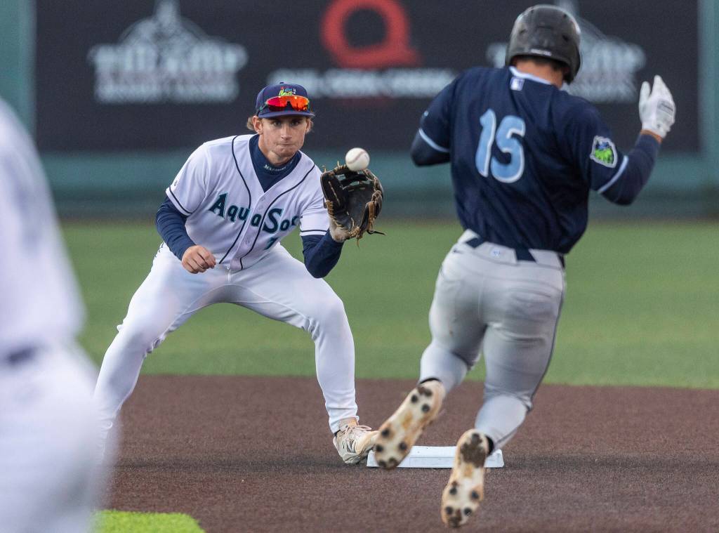 Everett AquaSox shortstop Colt Emerson catches the ball at second base for the first out in a double play during the Opening Day game against the Hillsboro Hops on Tuesday, April 8, 2025 in Everett, Washington. (Olivia Vanni / The Herald)