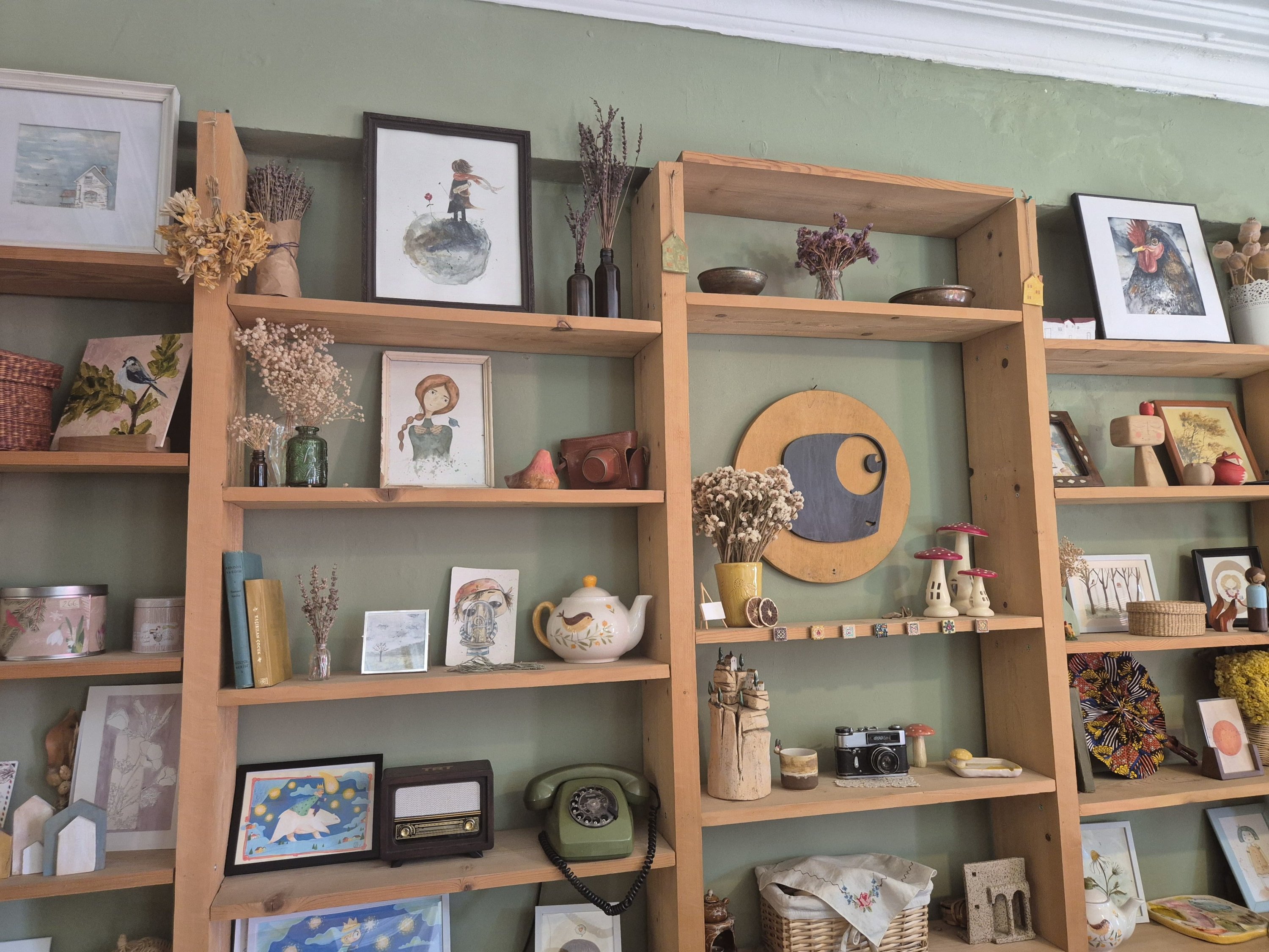 An art-filled corner with drawings and photographs at Atölye Balık, Istanbul, Türkiye, April 27, 2026. (Photo by Ayşe Sena Aykın)