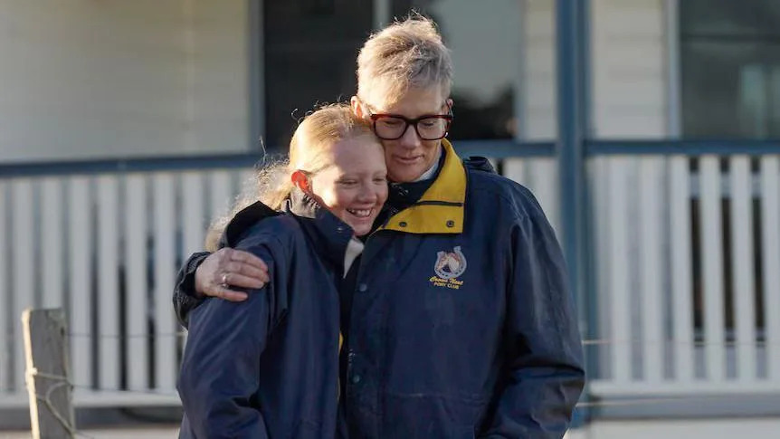 Chrissy Walters and her daughter Mia hug