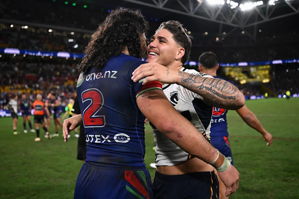 Reece Walsh congratulates Dallin Watene-Zelezniak. (Photo by Hannah Peters/Getty Images)