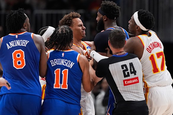 Tough guys: Australian star Dyson Daniels and New York Knicks centre Mitchell Robinson get up close and personal in game six of their play-off series. Both men were ejected.