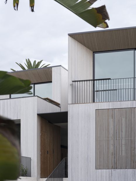 Birchgrove Husk is set within a natural amphitheatre, with the building designed to be embedded within its surrounding landscape.