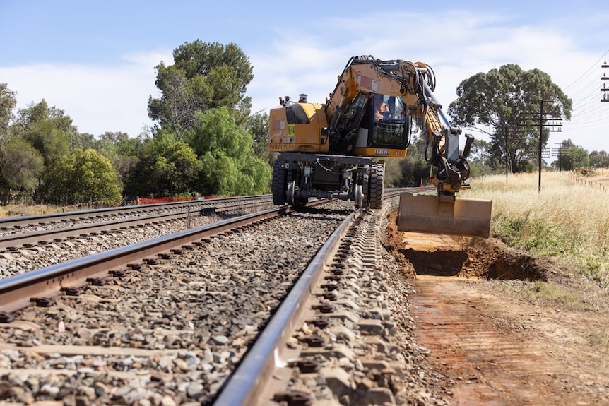 Heavy machinery working on rail lines
