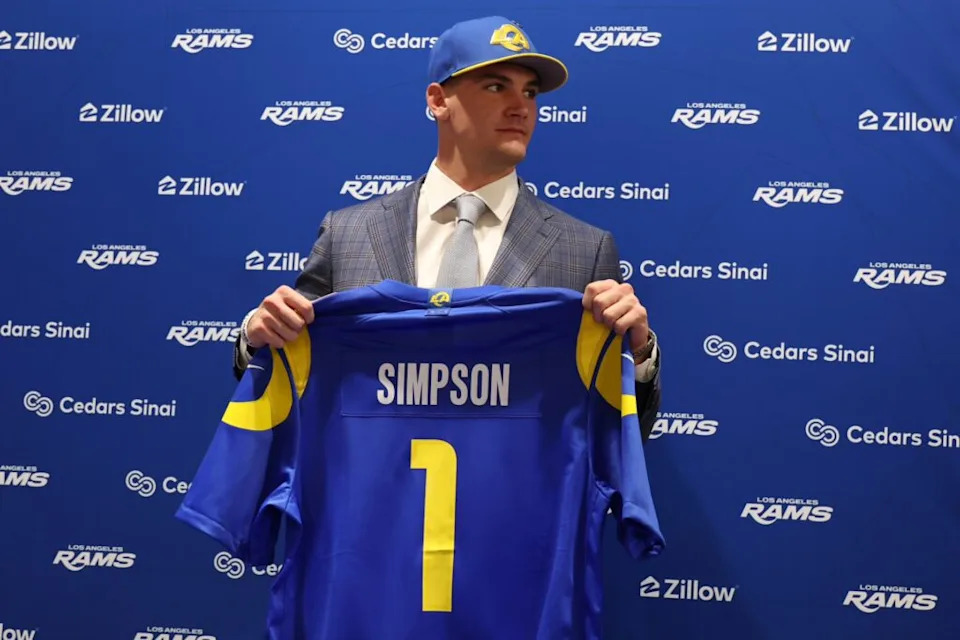 Los Angeles Rams first-round draft pick Ty Simpson poses with his jersey during a press conference at Code Next at Hollywood Park. Mandatory Credit: Kiyoshi Mio-Imagn Images