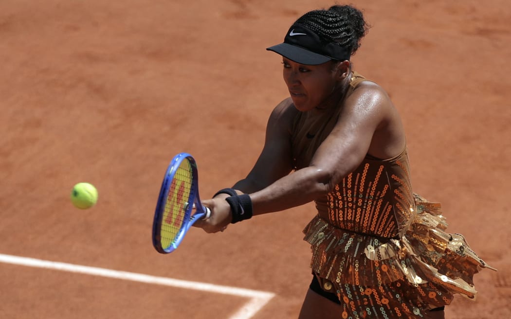 Japan's Naomi Osaka plays a backhand return to Croatia's Donna Vekic during their women's singles match on day 5 of the French Open tennis tournament on Court Simonne-Mathieu at the Roland-Garros Complex in Paris on May 28, 2026. (Photo by Thomas SAMSON / AFP)